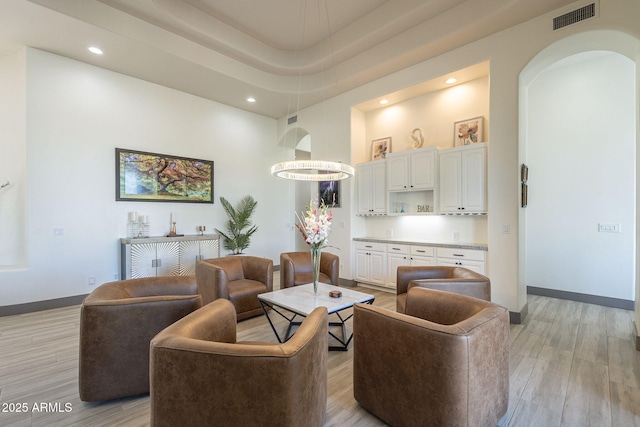 4915 N Greentree Dr, Litchfield Park, AZ 85340 - living room with light hardwood / wood-style flooring and a high ceiling