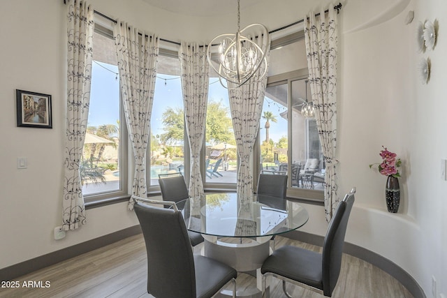 4915 N Greentree Dr, Litchfield Park, AZ 85340 - dining area featuring plenty of natural light, a chandelier, and light hardwood / wood-style flooring