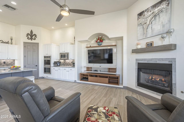 4915 N Greentree Dr, Litchfield Park, AZ 85340 - living room with ceiling fan and light hardwood / wood-style flooring