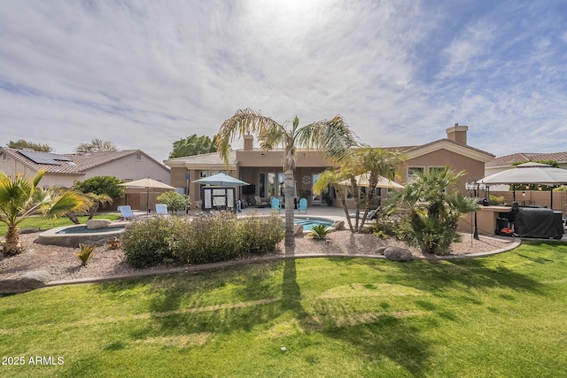 4915 N Greentree Dr, Litchfield Park, AZ 85340 - rear view of property with a gazebo, a yard, a jacuzzi, and a patio area