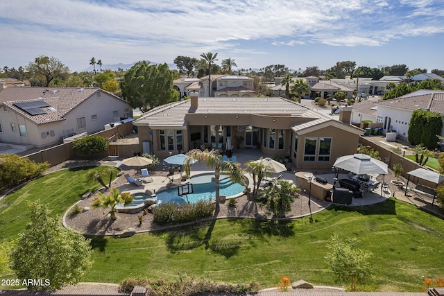 4915 N Greentree Dr, Litchfield Park, AZ 85340 - back of property with a patio and a lawn