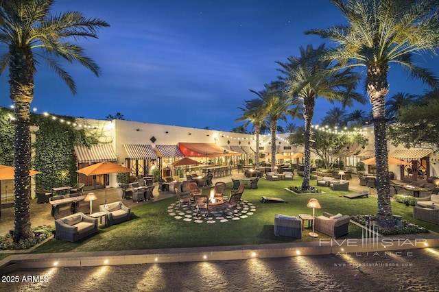4915 N Greentree Dr, Litchfield Park, AZ 85340 - exterior space featuring a water view, a lawn, and an outdoor living space with a fire pit