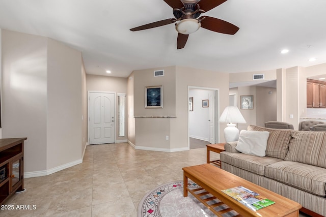 tiled living room featuring ceiling fan