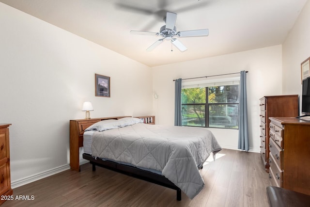 bedroom featuring dark hardwood / wood-style floors and ceiling fan