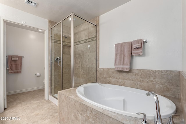 bathroom with independent shower and bath, tile patterned floors, and toilet