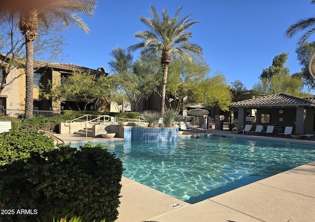 view of swimming pool with a patio area