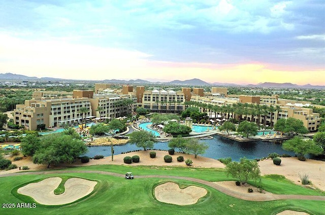 aerial view at dusk with a water and mountain view