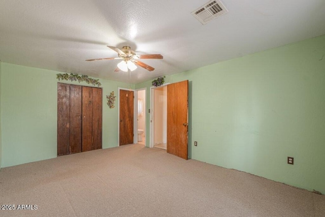 1055 S 4th St, Coolidge, AZ 85128 - unfurnished bedroom featuring ceiling fan, a closet, visible vents, and carpet