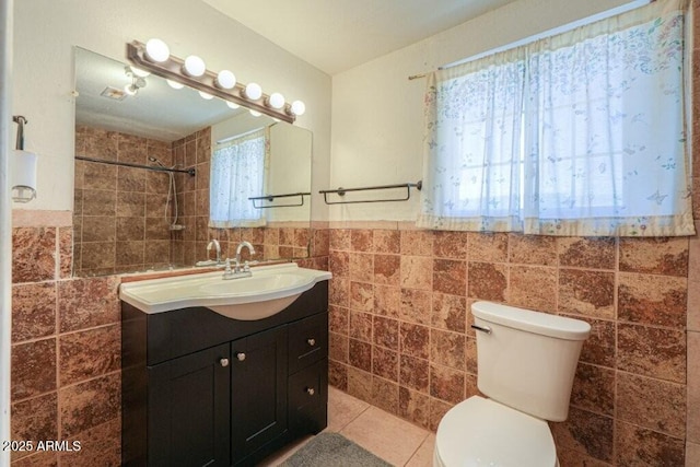 1055 S 4th St, Coolidge, AZ 85128 - full bath with tile patterned flooring, tile walls, a wealth of natural light, and toilet
