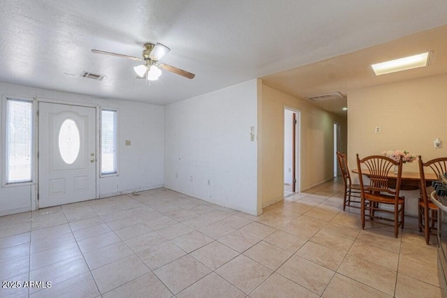 1055 S 4th St, Coolidge, AZ 85128 - foyer entrance with visible vents, a ceiling fan, and light tile patterned floors