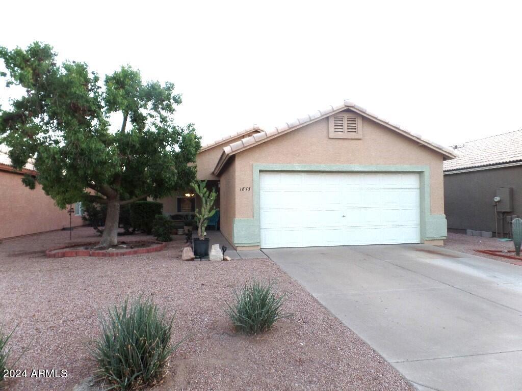 ranch-style house featuring a garage