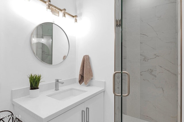 bathroom with vanity and an enclosed shower