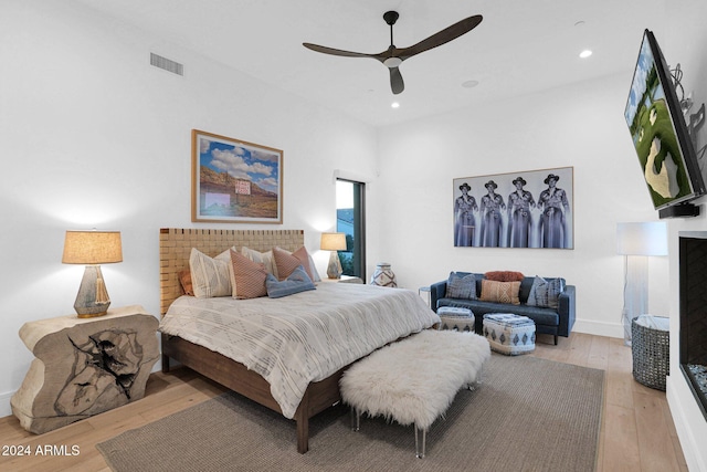 bedroom featuring ceiling fan and light hardwood / wood-style flooring