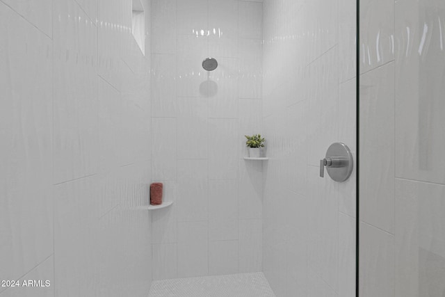 bathroom with a tile shower