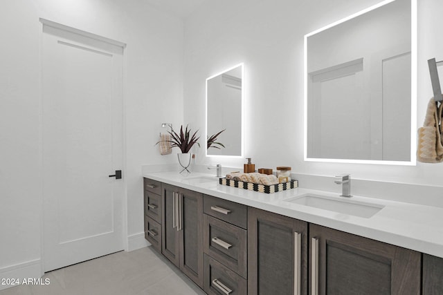 bathroom with tile patterned floors and vanity