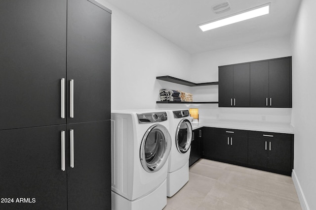 laundry area featuring cabinets and independent washer and dryer