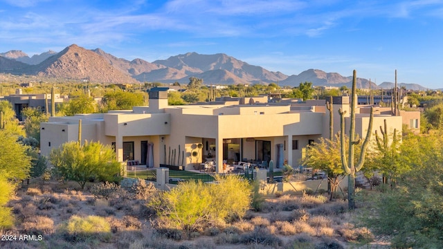 back of house with a mountain view