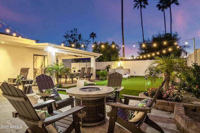 patio terrace at dusk with a fire pit