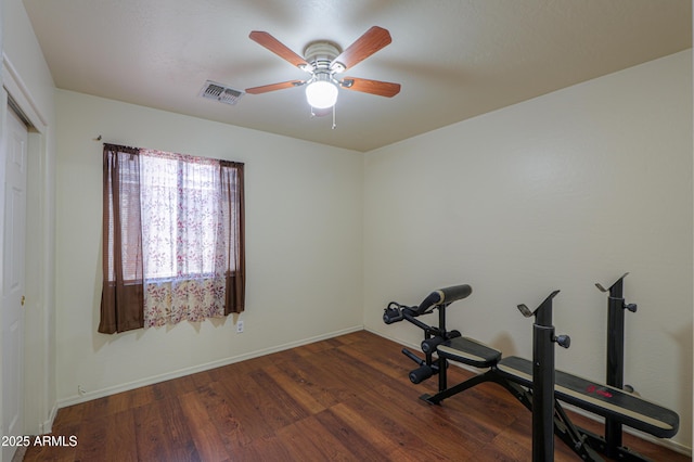 workout area featuring hardwood / wood-style flooring and ceiling fan