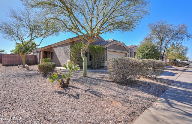 view of front of property with a garage