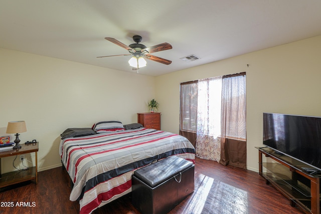 bedroom with ceiling fan and dark hardwood / wood-style flooring