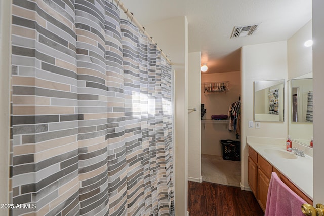 bathroom featuring vanity and hardwood / wood-style flooring