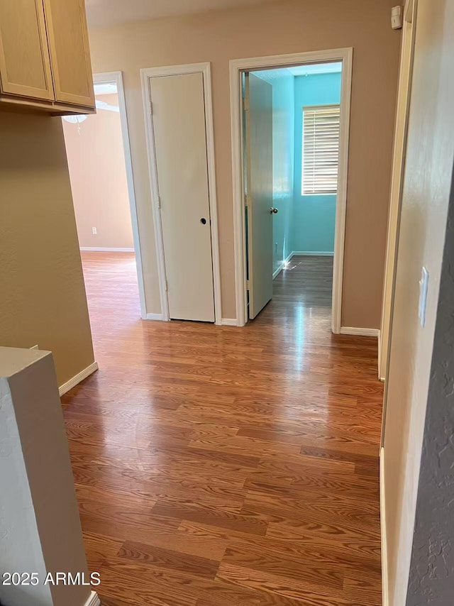 8507 W Pioneer St, Tolleson, AZ 85353 - hallway with wood finished floors