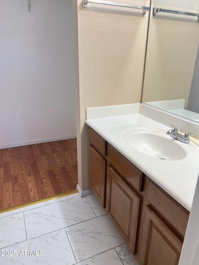 8507 W Pioneer St, Tolleson, AZ 85353 - bathroom featuring vanity and marble look tile flooring