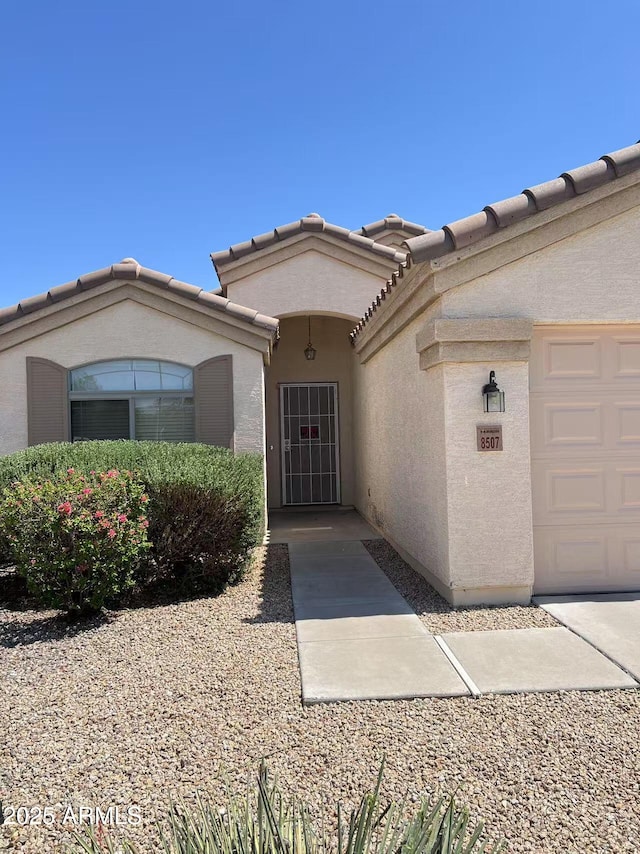 8507 W Pioneer St, Tolleson, AZ 85353 - entrance to property featuring stucco siding and an attached garage