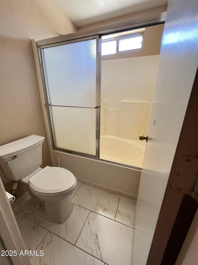 8507 W Pioneer St, Tolleson, AZ 85353 - full bath with marble look tiles and shower / bath combination with glass door