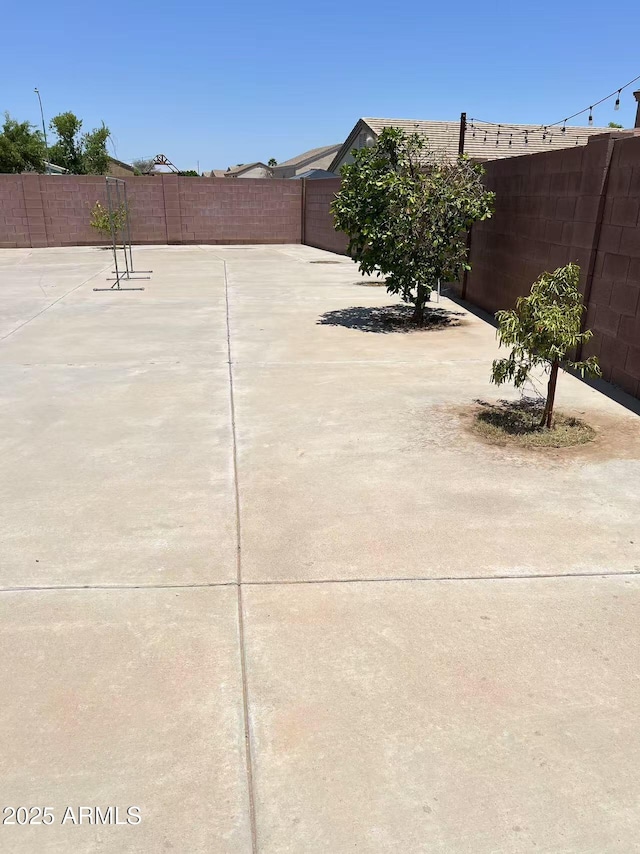 8507 W Pioneer St, Tolleson, AZ 85353 - fenced backyard with a patio