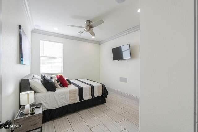 bedroom with ceiling fan, light wood-type flooring, and crown molding