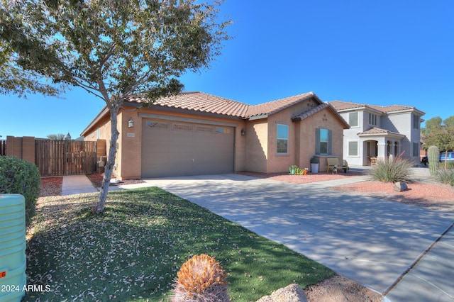 mediterranean / spanish-style house featuring a garage