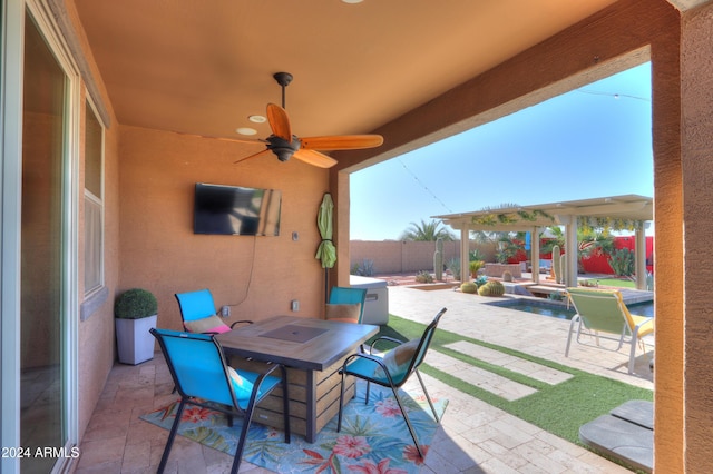 view of patio / terrace featuring ceiling fan