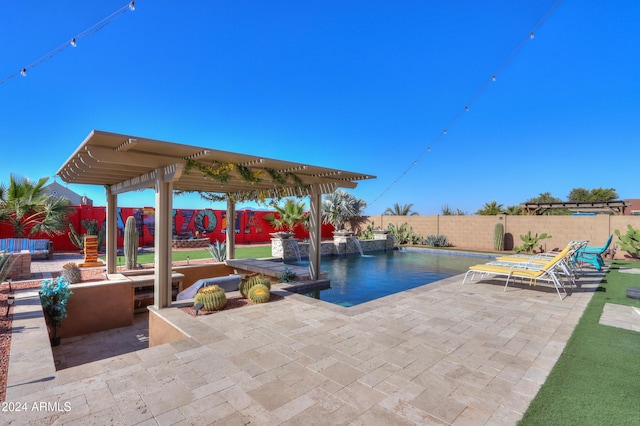 view of swimming pool with pool water feature and a patio