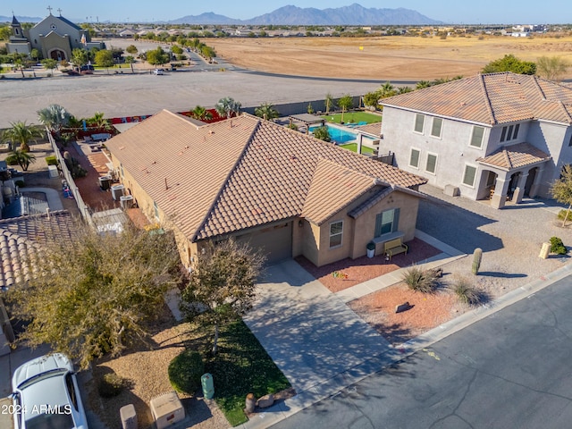 birds eye view of property with a mountain view