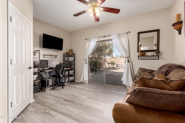 office space featuring light wood-style floors and a ceiling fan