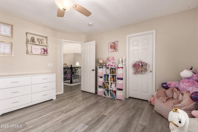 game room featuring ceiling fan and light wood-style flooring