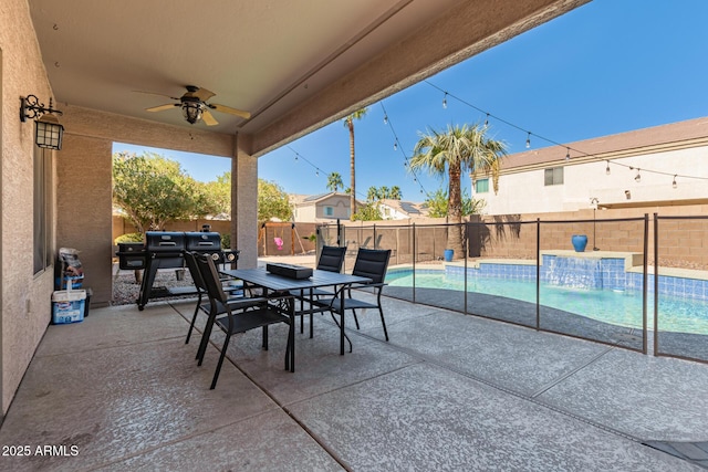 view of patio / terrace featuring ceiling fan, a fenced backyard, outdoor dining area, and a fenced in pool