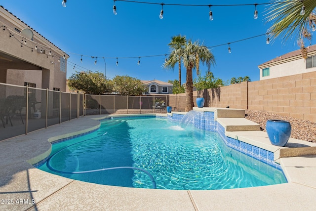 view of swimming pool with a fenced backyard and a fenced in pool