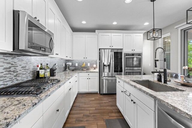 974 W Zion Way, Chandler, AZ 85248 - kitchen with appliances with stainless steel finishes, a sink, dark wood-style floors, recessed lighting, and white cabinets