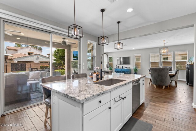 974 W Zion Way, Chandler, AZ 85248 - kitchen featuring open floor plan, a sink, stainless steel dishwasher, ceiling fan, and light wood-style floors