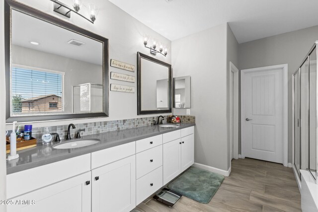 974 W Zion Way, Chandler, AZ 85248 - bathroom featuring a stall shower, double vanity, and baseboards