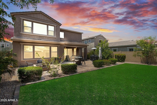 974 W Zion Way, Chandler, AZ 85248 - back of house at dusk with a patio area and stucco siding