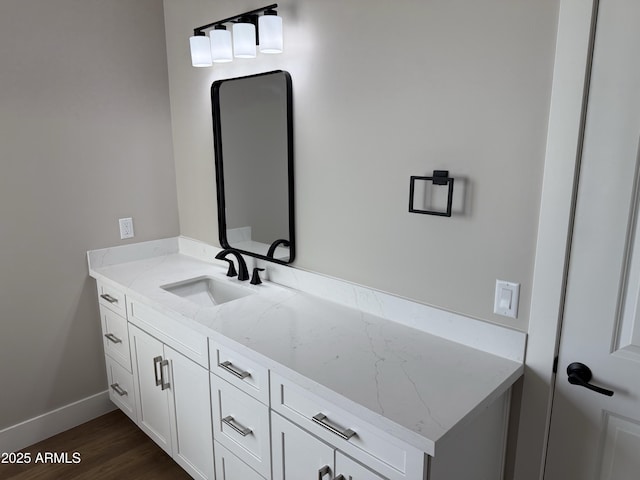 bathroom with hardwood / wood-style flooring and vanity