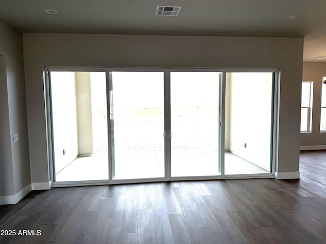 unfurnished room featuring dark hardwood / wood-style flooring