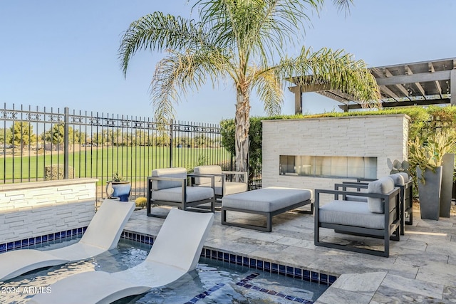 view of patio / terrace featuring an outdoor stone fireplace