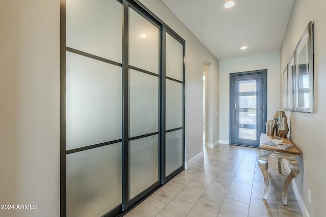 entryway featuring light tile patterned flooring