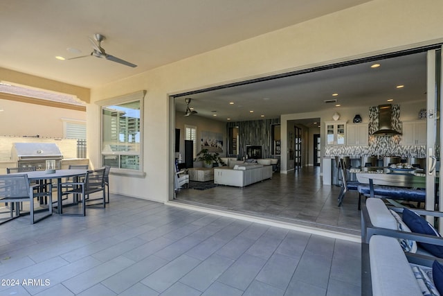 view of patio featuring ceiling fan