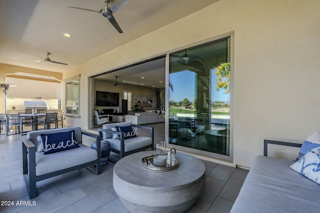 view of patio / terrace featuring ceiling fan and grilling area